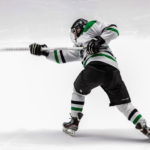 Dynamic hockey player unleashing a powerful shot on goal